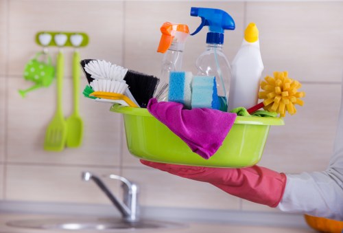 Professional cleaner in Barnet tidying a bright home interior