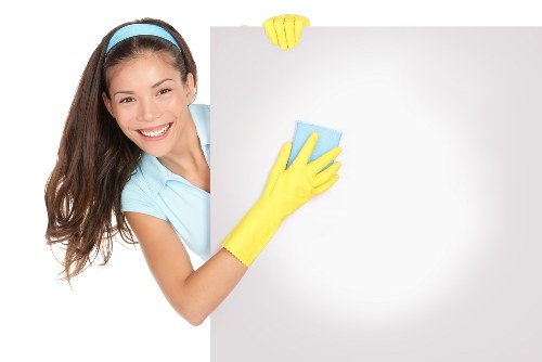 Hand holding a note highlighting a cleaning service issue